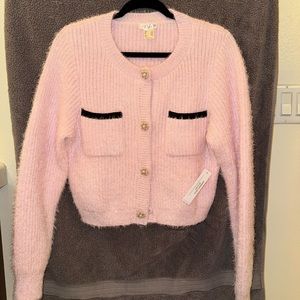 3 piece suit. Includes jacket, top, and skirt.